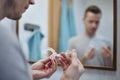 Man preparing silicon tray for teeth whitening Royalty Free Stock Photo