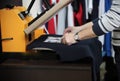 Man preparing t-shirt for printing in the silk screen printing machine. Only hands