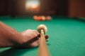 Man preparing to break spheres in billiards.