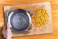 Man preparing to cook dried Italian rotini pasta Royalty Free Stock Photo