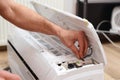 Man preparing to install new air conditioner. Modern air conditioner during the installation process Royalty Free Stock Photo