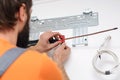 Man preparing to install new air conditioner. Modern air conditioner during the installation process Royalty Free Stock Photo