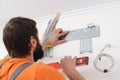 Man preparing to install new air conditioner. Modern air conditioner during the installation process