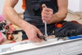 Man preparing to install new air conditioner. Modern air conditioner during the installation process