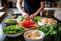 man preparing turkey lettuce wraps by a counter Royalty Free Stock Photo