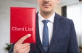 Man presenting client list notebook Royalty Free Stock Photo