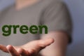 Man presenting 3D rendered GREEN icon above his palm