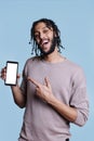 Man presenting mobile phone with white screen for advertisement