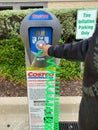 A man press the button on the Costco air pump