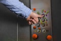 Man press button in elevator with germs, closeup Royalty Free Stock Photo