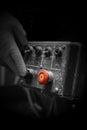 Man pressing button on an industrial machine control panel. With lighting effect Royalty Free Stock Photo