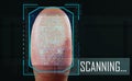 Man pressing control glass of biometric fingerprint scanner on dark background, closeup.