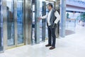Man Pressing Elevator Button in Modern Building Royalty Free Stock Photo