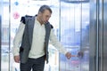 Man Pressing Elevator Button in Modern Building Royalty Free Stock Photo