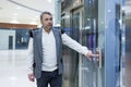 Man Pressing Elevator Button in Modern Building Royalty Free Stock Photo