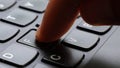 Man pressing the letter F key on a simple laptop computer keyboard, object, finger macro, detail, extreme closeup, pushing the f