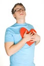 Man pressing to bosom red paper heart Royalty Free Stock Photo