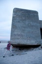 Man pretending to lift World war II bunker ruins