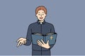 Man priest reads bible and gestures calling on people to accept christian or catholic religion Royalty Free Stock Photo