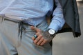 Man with Prisma watch and blue gem ring before Giorgio Armani fashion show, Milan Fashion Week street style on