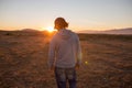 Man in a pristine landscape during a beautiful blazing sunset Royalty Free Stock Photo