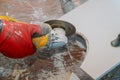 Man professional worker cutting tile with circular saw electric Royalty Free Stock Photo