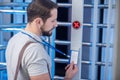 Man in profile applying badge to reader device