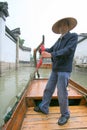 Man propelling a water taxi on canal Royalty Free Stock Photo