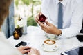 Man proposing girlfriend with diamond ring at cafe Royalty Free Stock Photo