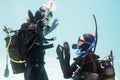 Man proposing marriage in scuba gear Royalty Free Stock Photo