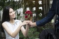 A man is proposing marriage to a smiling woman Royalty Free Stock Photo