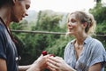 Man proposing to his happy girlfriend outdoors love and marriage concept Royalty Free Stock Photo