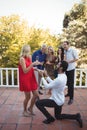 Man proposing woman in balcony Royalty Free Stock Photo