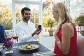 Man proposing woman while having meal Royalty Free Stock Photo