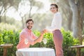 Man proposing a woman with a ring on his knee in the restaurant Royalty Free Stock Photo