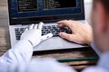 Man With Prosthetic Hand Working On Laptop