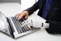 Man With Prosthetic Hand Working On Laptop