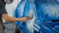 Spray gun with paint for painting a car Royalty Free Stock Photo