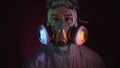 Man in protective costume suit, gas protect medical spray paint mask. Doctor in respirator. Concept health virus