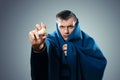 Man in protective mask against infectious diseases and flu. Photo of sick man holding a garlic. Close up. Healthcare concept Royalty Free Stock Photo