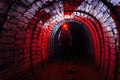 Man in protective suit inside abandoned uranium mine