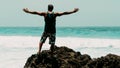 Man Provoke Ocean Waves on Tembeling Coastline at Nusa Penida island, Bali Indonesia Royalty Free Stock Photo