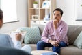 Man and psychologist at psychotherapy session Royalty Free Stock Photo