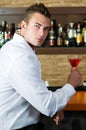 Man in a pub with martini waiting Royalty Free Stock Photo