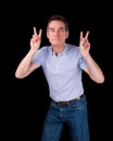 Man Pulling Face Making Two Finger Sign
