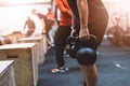 Man pulling kettlebells weights in the functional fitness gym Royalty Free Stock Photo