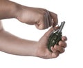 Man pulling safety pin out of hand grenade on white background, closeup Royalty Free Stock Photo