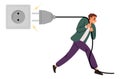 Man pulls electrical plug out of socket. Saving energy and reducing electricity costs. Turn off equipment. Tiny guy with big Royalty Free Stock Photo