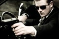 Man pulls a gun in car Royalty Free Stock Photo