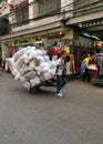 Man pulls a hand truck